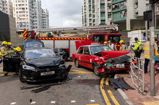 Hong Kong - April 2, 2021 : Firefighters working at the car crash accident in Whampoa, Kowloon, Hong Kong.