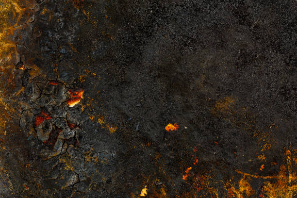istock Bottom side of a cast iron pan with thicl layer of soot on it. 1310620260