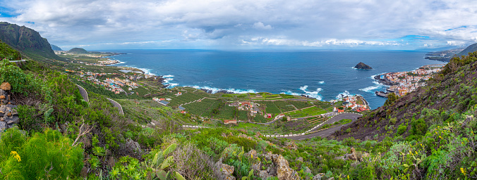 Wide view of the city of Nazaré, the beach, cliffs, funicular  and the fort of São Miguel Arcanjo