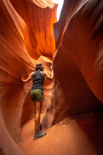A young woman on the Lower Antelope Arizona trail. USA