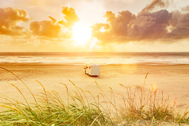 Motorhome on a sandy beach by the sea