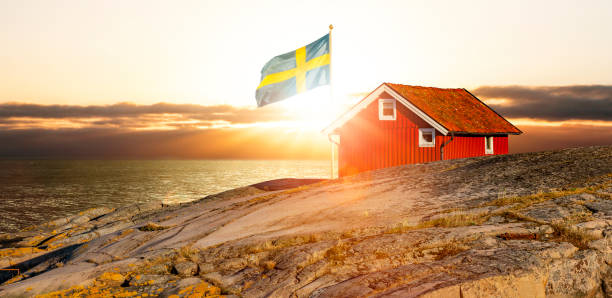 Red house with flag on the Swedish archipelago