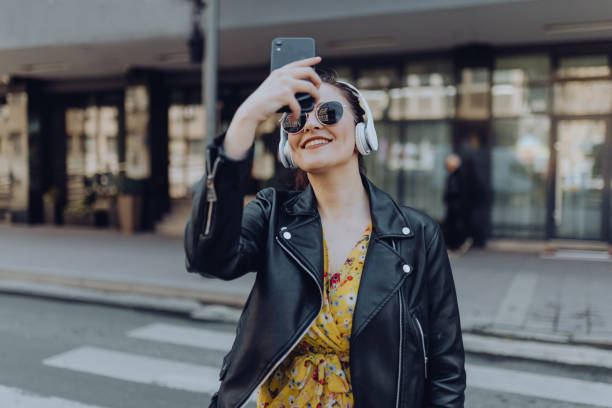 istock Young woman walking on street 1310623872