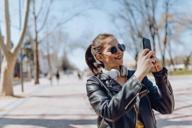 istock Young woman walking on street 1310623924
