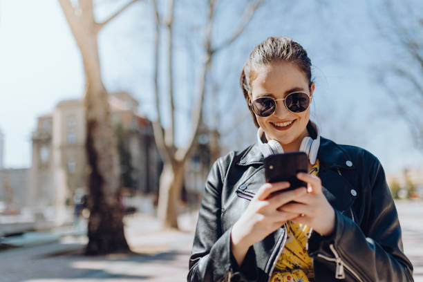 istock Young woman walking on street 1310623972