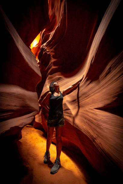 a young girl admiring the beauty of the upper antelope canyon in the town of page, arizona. united states"t - upper antelope canyon imagens e fotografias de stock