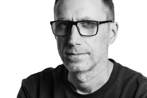 istock Handsome man in spectacles. Black and white portrait isolated on white 1310627667