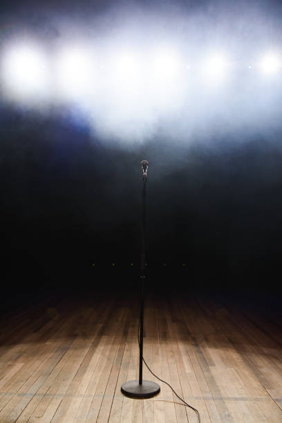 istock Live music background. Microphone and stage lights. Sing and karaoke. 1310628277