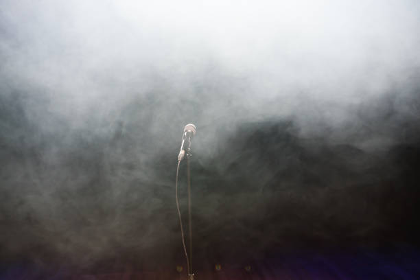 istock Live music background. Microphone and stage lights. Sing and karaoke. 1310628933