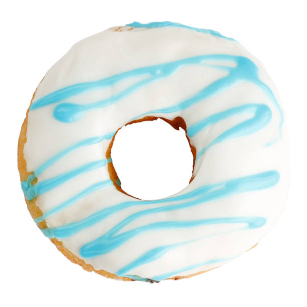 istock Donut in white glaze drizzled with blue topping. 1310635504