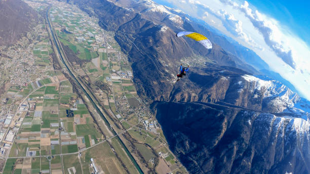 istock Parasailer soars above Swiss mountain landscape 1310636933