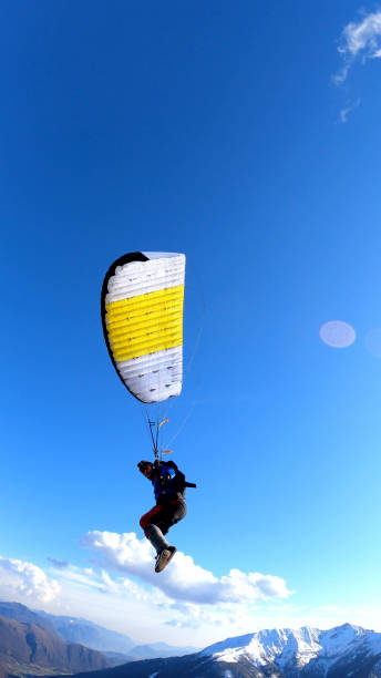 istock Parasailer soars above Swiss mountain landscape 1310637524