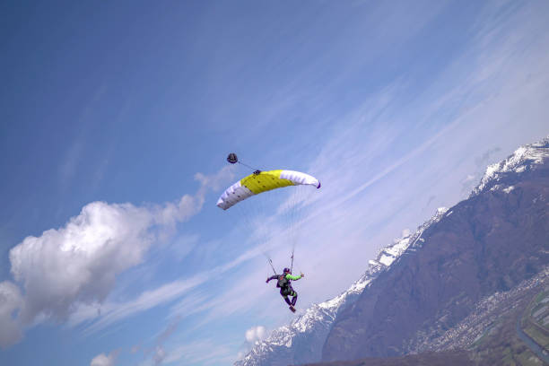 istock Parasailer soars above Swiss mountain landscape 1310637526