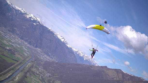 istock Parasailer soars above Swiss mountain landscape 1310637530