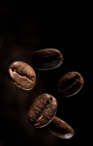 istock coffee beans hanging in the air 1310639622