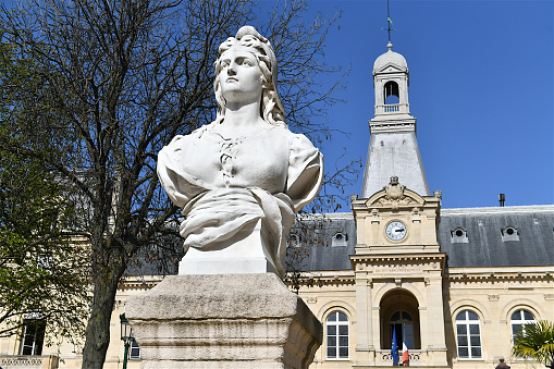 Paris, France-03 31 2021:The Bust of Marianne, symbol of the French republic disposed in front of the town hall of the 14 th arrondissement of Paris, France.
