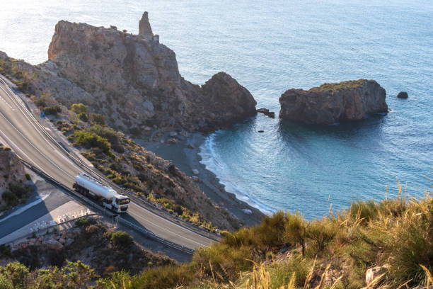 istock Fuel tanker driving on a mountain road 1310642352