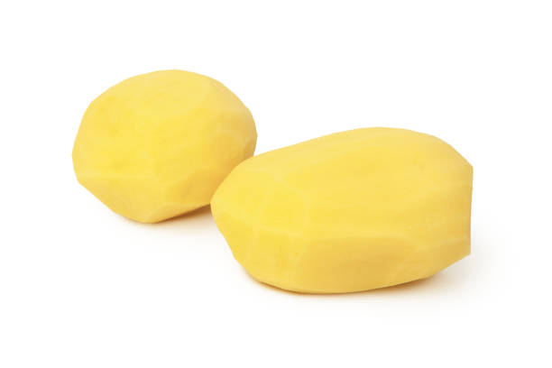 istock Raw peeled potato isolated on white background 1310642943