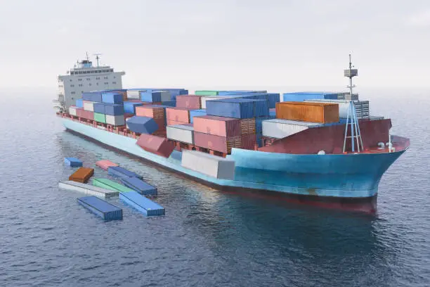 Containers falling off to sea from cargo ship.