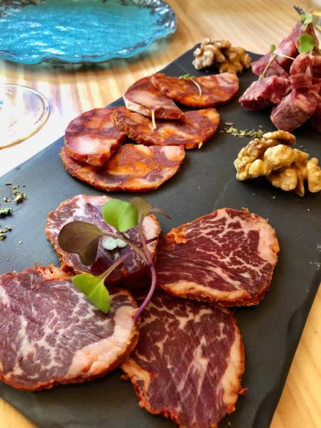 istock Appetizer plate, Spanish ham and salami with herbs and nuts 1310647553