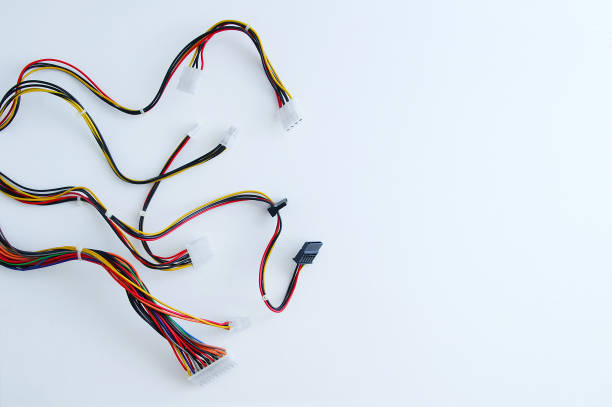 istock Power supply wires for personal computer close-up white background. 1310647561