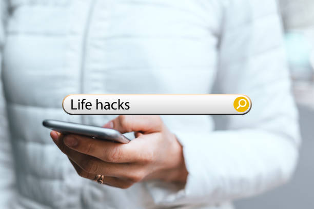 concept life hacks in the search bar on the background of a woman with phone. concept life hacks in the search bar on the background of a woman with phone lifehack stock pictures, royalty-free photos & images