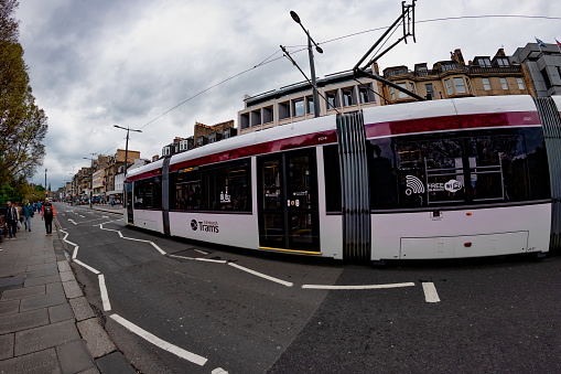 One of Edinburghs trams makes its way west along Princes Street