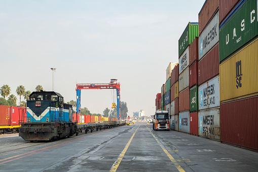 icel, Turkey - December, 22 2019 : Railroad train freight container carriers in an international port.