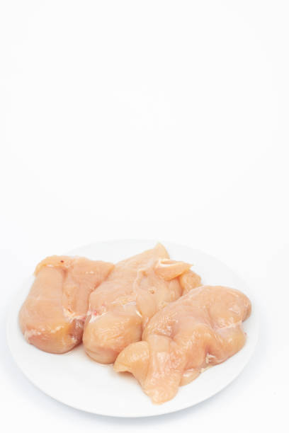 istock Raw Chicken Breasts on the plate above white background 1310651701
