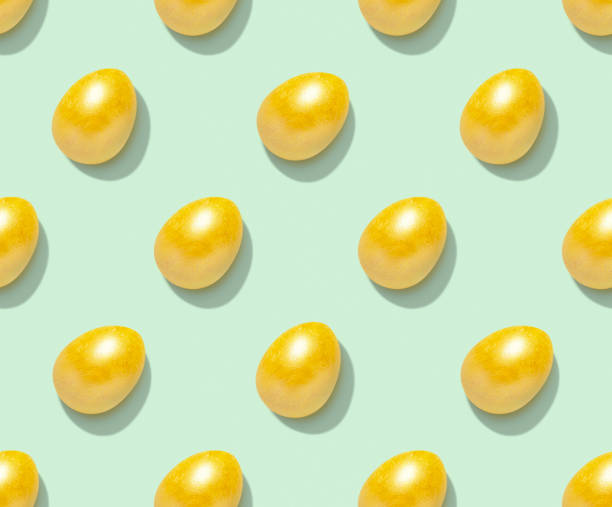 istock Easter pattern with golden eggs on pastel green background. Top view. 1310654255