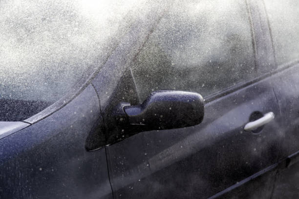 istock Washing car with hose 1310655244