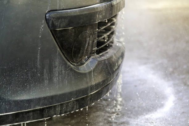 istock Washing car with hose 1310655245