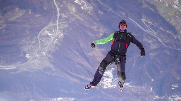 istock Freefall jumper soars above Swiss mountain landscape 1310658083