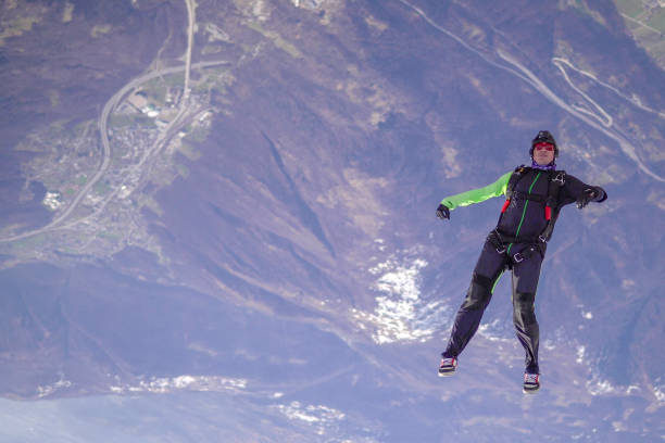 istock Freefall jumper soars above Swiss mountain landscape 1310658085