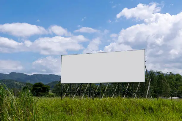 roadside advertising panel with views of the mountains