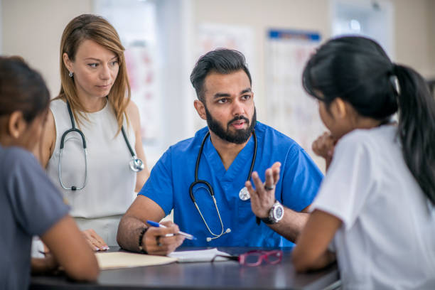 istock Multi Ethnic Doctors and Nurses In A Meeting Together 1310664418
