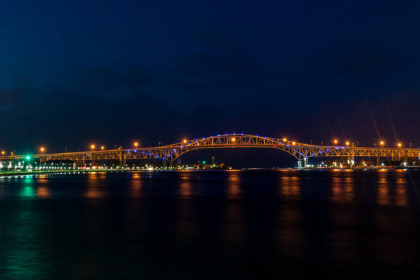 istock Blue Water Bridge At Night Lights Up The St. Clair River Waterfront 1310674576