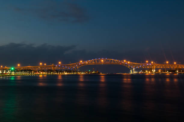istock Blue Water Bridge At Night Lights Up The St. Clair River Waterfront 1310674609