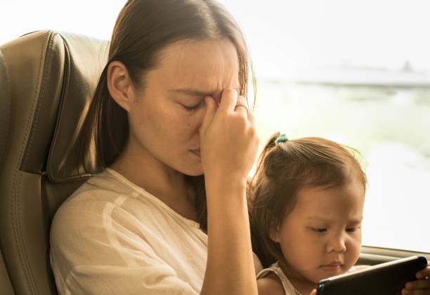 a unhappy stressed and tired mother traveling with her child. depression. - bus family travel destinations women imagens e fotografias de stock