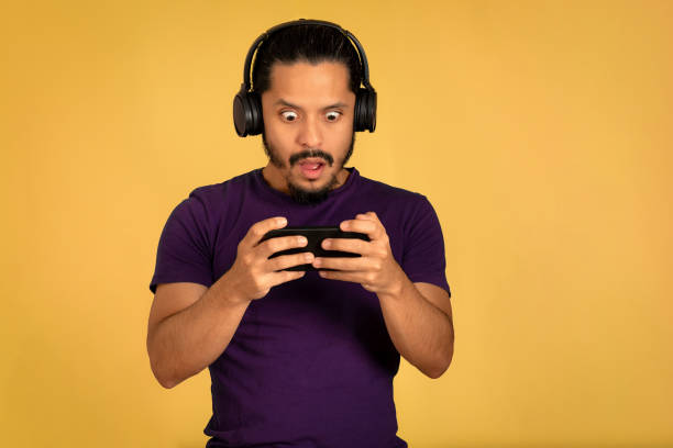 istock Young man portrait with yellow background 1310678370
