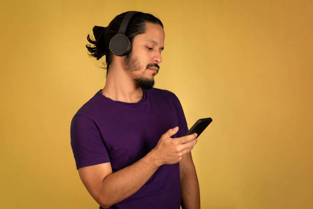 istock Young man portrait with yellow background 1310678455