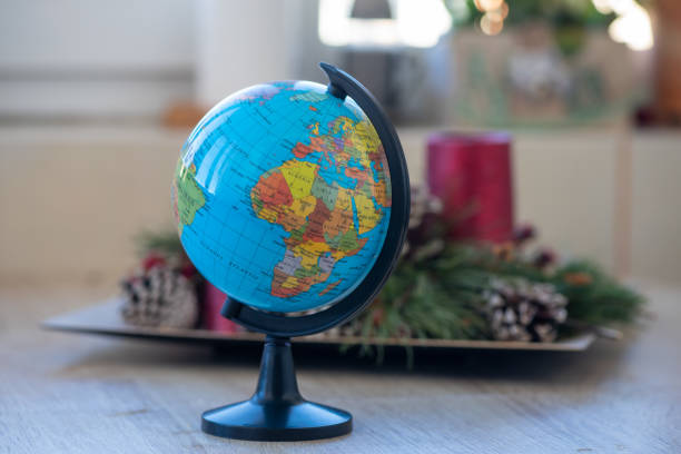 istock Toy globe on a wooden table 1310687908
