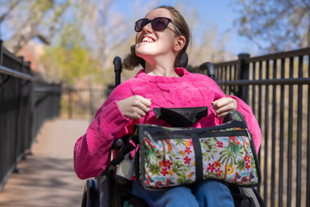 Woman With Disability Exploring A woman in a wheelchair with a disability exploring disabled person hiking outdoors stock pictures, royalty-free photos & images