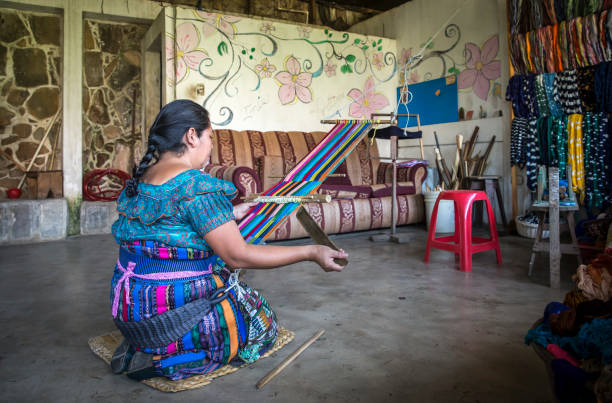 Indigenous woman preparing flour for casabe (traditional amazon bread) in Guainía, Colombia