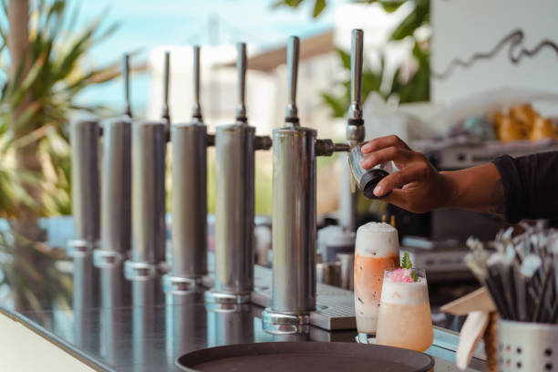 istock Barista making fresh juice with many nitrogen cold brew coffee machine. 1310698518
