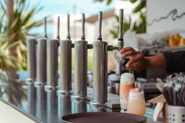 istock Barista making fresh juice with many nitrogen cold brew coffee machine. 1310698583