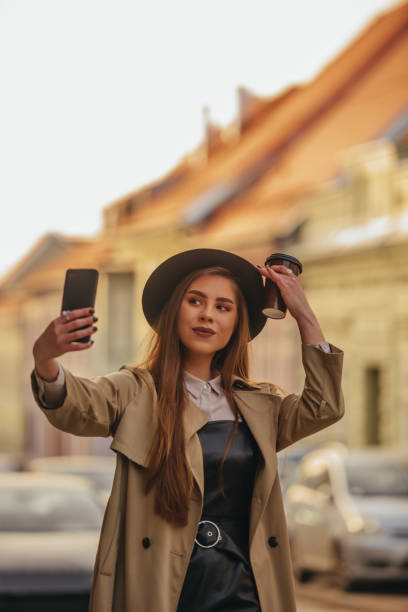 istock Woman taking selfie with her smartphone 1310699289