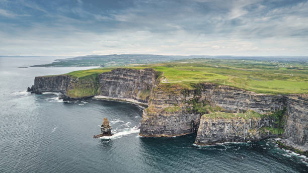 Cliffs of Moher Panorama Ireland Drone Aerial View Wild Atlantic Way Cliffs of Moher Panorama Ireland. Scenic aerial drone point of view towards the famous Cliffs of Moher Coastline under beautiful sunny summer skyscape. Aerial Drone Point of View. Burren Region, County Clare, Ireland, Northern Europe, Europe doolin photos stock pictures, royalty-free photos & images