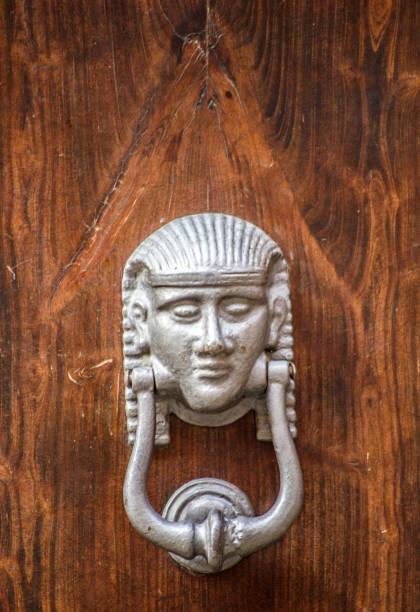 istock sphinx, artistic knocker of the ancient door 1310702074