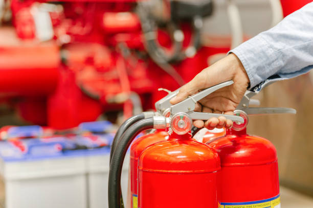 istock Engineer inspection Fire extinguisher and fire hose,Ready to use in the event of a fire.Safety first concept. 1310702323